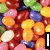 Pixelated candy beans fill the background with red, green, yellow, orange, purple, and white colors; text "I Love" appears in top-right corner and "candy" at bottom-left.