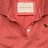 Four static display close-ups of polo shirt collars in red, green, blue, and gray with fabric texture details