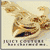 Animated icon shows a golden mask with dark eye openings on light background, transitioning to pink banner with 'JUCY' text and crown emblem.