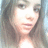 Pixelated static image of a person with long dark hair, light skin, and a neutral expression, cropped to show upper body against a blurred background.