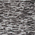 A pixelated image shows a character with messy hair and dark clothing against a background, partially overlaid by color bars