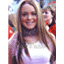 A static image shows a person with long brown hair wearing a white top, positioned next to text reading "Lindsay Lohan" and "JACKPOT" on a gray background.