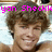 Pixelated image of a smiling person with brown curly hair, overlaid with pink text reading 'yan Sheckki love you!'