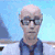 Pixelated image of a person with light skin, bald head, dark sunglasses, and blue shirt against light blue background.
