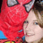 Pixelated image of a person with red hair and light skin wearing blue clothing, partially cropped on the right side.
