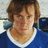 Pixelated portrait of a person in a blue shirt with white collar next to cyan text memorializing Casey Calvert (1981-2007).