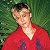A pixelated contact sheet showing two frames of an animated icon featuring a person in a red shirt against green foliage on the left and green text reading "Original Icons .com" on the right.