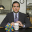 A pixelated image shows a person in business attire holding a colorful object and a white cup, next to text reading "That's What She Said!" on the right.