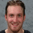 A pixelated image shows a person with short brown hair and light skin, wearing a dark shirt against a gray background. Below is the Pittsburgh Penguins logo on white.