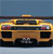 Pixelated image of a yellow and brown vehicle with dark windows and red taillights against a blue background.