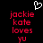 Pixelated red text on black background with white heart symbol above, displaying 'jackie kate loves yu' in two identical vertical