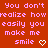 Red background with pink pixelated text reading 'You don't realize how easily you make me smile' and two white heart symbols.