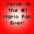 Four identical red circular icons with white gradient centers display black pixelated text reading "Jacob is the #1 Mario Fan Ever!" in a