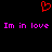 Red pixelated heart symbol above pink text reading 'Im in love' repeated twice on black background.