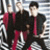 A 2x2 contact sheet of a green-day-themed animated buddy icon showing three figures in red and black attire against striped background with pixelated text overlays reading "This is our lives on..." and "HOLIDAY".