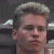 A pixelated image of a person with light brown hair styled upward, positioned next to green text reading 'Original Icons .com' on a dark background.
