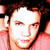 Static 50x50 pixel icon showing a close-up of a person's face with dark hair, rendered in low-resolution pixel art style using warm tones and visible dithering.
