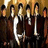Pixelated image of a group of people with yellow text reading Samantha Loves Screamo ALESANA on a black background.