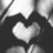 Black-and-white pixelated image with two heart shapes and text reading 'Cam<33' in the upper right corner.