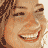 Pixelated of three showing sequential facial expressions and head positions on a single person's face with warm brown tones