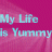 Pixelated text reads 'My Life Is Yummy' in light blue on a pink gradient background with visible pixelation.