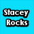 A static image with a bright blue background displaying the text "Stacey Rocks" in bold white letters outlined in black, alongside a partial view of an acoustic guitar on a dark reflective surface.