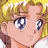 Pixelated close-up of a character with blonde hair, blue eyes, and a neutral expression, rendered in a low-resolution style.
