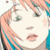 Pixelated close-up of a stylized face with peach-toned hair, teal accents, and a small star near the right cheek, set against a light background.