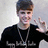 A person in a black hoodie with white text gestures peace sign against light background.
