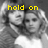 A grayscale image of two people in a close embrace with yellow pixelated text above them, changing across three