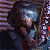 Pixelated image of a character with long dark hair and blue goggles, holding an object against a striped background next to green text reading "Original Icons .com".