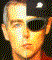 Pixelated image of a person wearing dark sunglasses and a black cap with a white emblem, displayed in two side-by-side frames showing slight facial expression changes.
