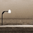 A split-screen image with a streetlamp on the left and red text 'bamer' on black background right.