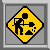 Yellow diamond-shaped warning sign with black border and black construction worker figure holding a shovel, set against gray background.