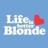 Pixelated icon with light blue background, white text reading 'Life Blonde', and a red heart symbol to the right of the text.