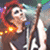 Animated sequence of a person with red hair singing into a microphone, wearing dark clothing and holding a guitar, against a blurred stage background.
