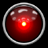 A static circular icon with a glossy red center, silver border, and central glowing light against black background.