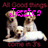 Pixelated image of two light brown dogs sitting side-by-side on a white surface with pink text above them and dark red text below.