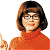 A pixelated contact sheet showing two frames of an animated icon featuring a cartoon woman in orange turtleneck and glasses on the left, with green text "Original Icons .com" on dark green background to the right.