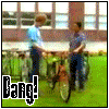 animated frames showing a person with curly red hair in a blue shirt, cycling and turning their head while text overlays change from 'Bang!', 'you got shocks..', 'Pegs...', to repeated 'Lucky!'