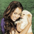 A pixelated image shows a person with long dark hair embracing another figure in light-colored clothing against a green background.