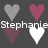 Pixelated heart icons arranged in a with text overlays reading "Stephanie Michele" and "Loves You" on a dark background