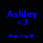 Blue pixelated text 'Ashley' with '<3' below it and five blue heart symbols beneath, displayed on a black background.