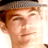 Static 48x48 pixel icon showing a close-up of a person's face with light brown hair and a gray cap, rendered in low-resolution pixel art style on white background.
