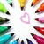 A circular arrangement of colorful pixelated icons surrounding a central pink heart shape on white background.