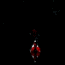 A red-shirted figure in a sequence of four vertical poses against a black background, transitioning from hands clasped to arms raised.