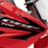 Pixelated image of a red vehicle with blue text reading 'This is my passion' and 'This is my most prized possession This is my Honda!! (Dirtbike)'