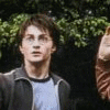 Two people stand outdoors with hands raised; one wears a dark jacket over light blue shirt, the other pink zip-up sweater. Text below reads "we weren't making out, Professor Honest!" in white pixelated font on black background.