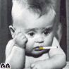 Black-and-white image of a baby with spiky hair holding various objects near its mouth in