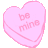 A pink heart-shaped candy with 'BE MINE' text in pixelated style on a gray background.